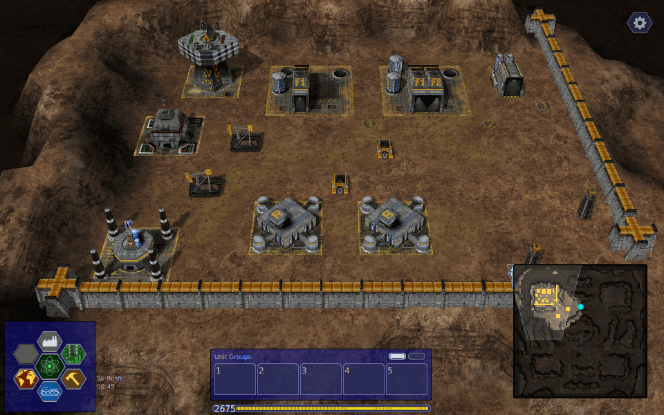 Warzone 2100 running in the browser — a skirmish base with factories, research facilities and oil derricks behind a wall